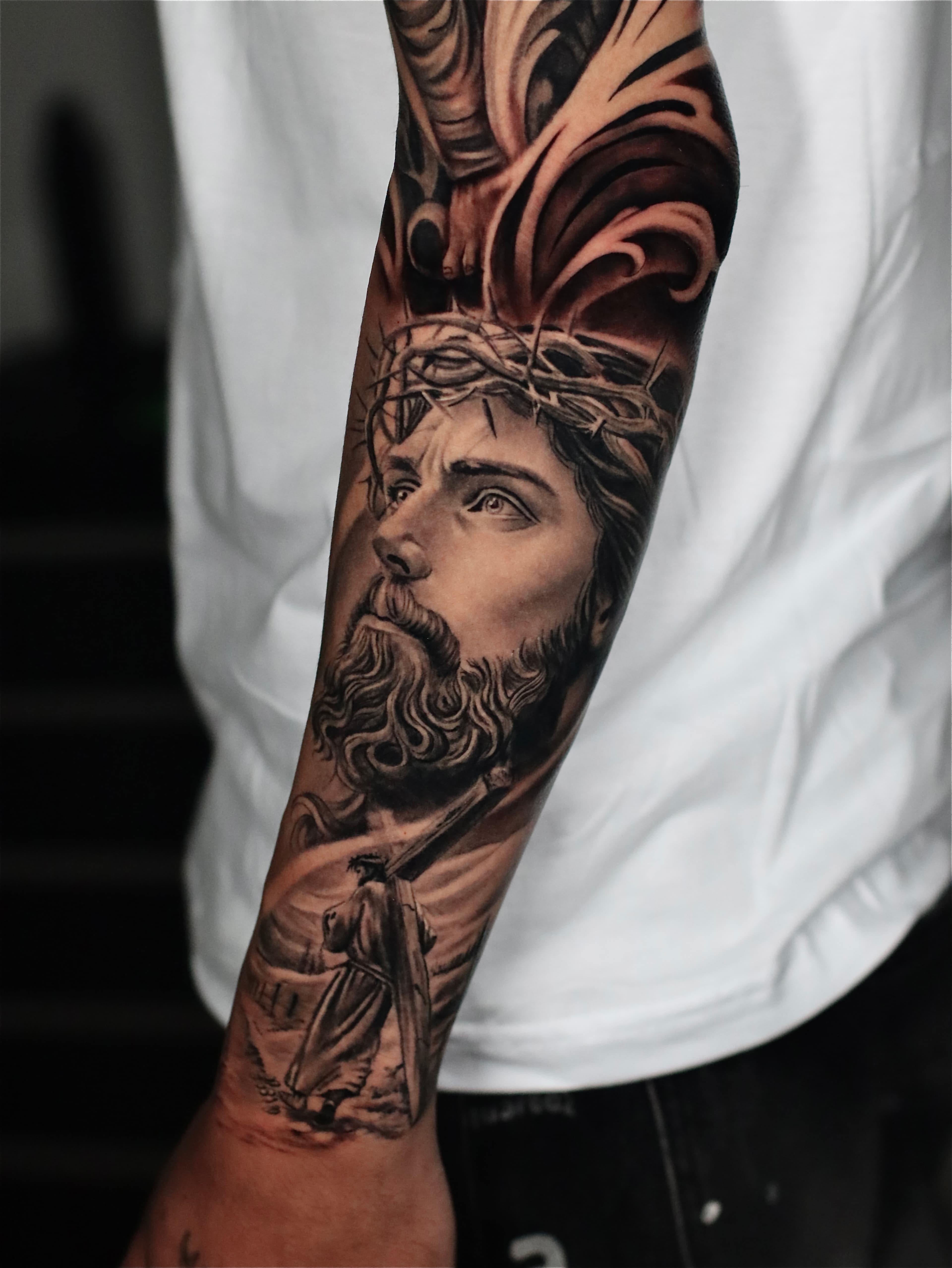 Religious forearm tattoo