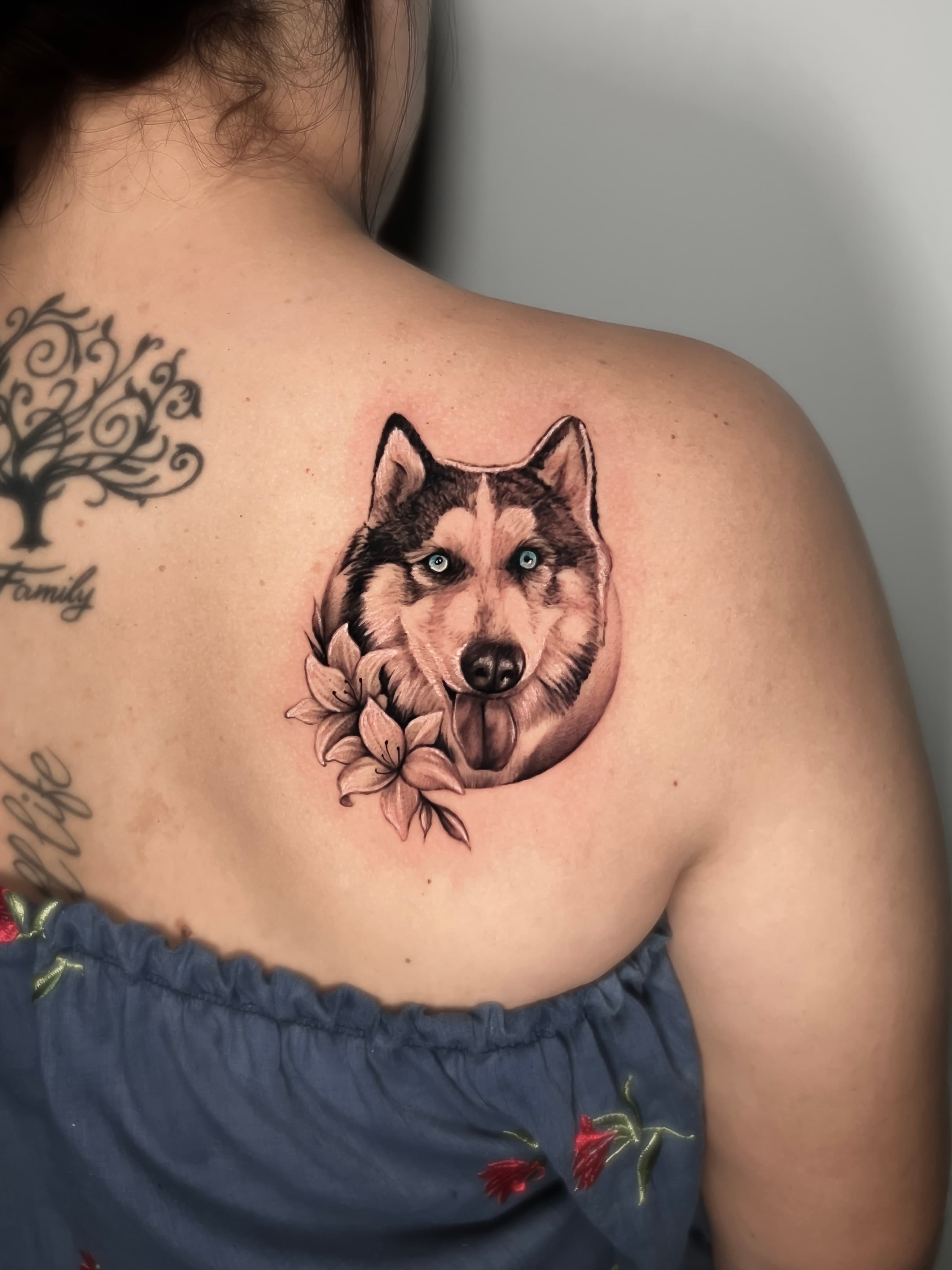 Upper back husky tattoo