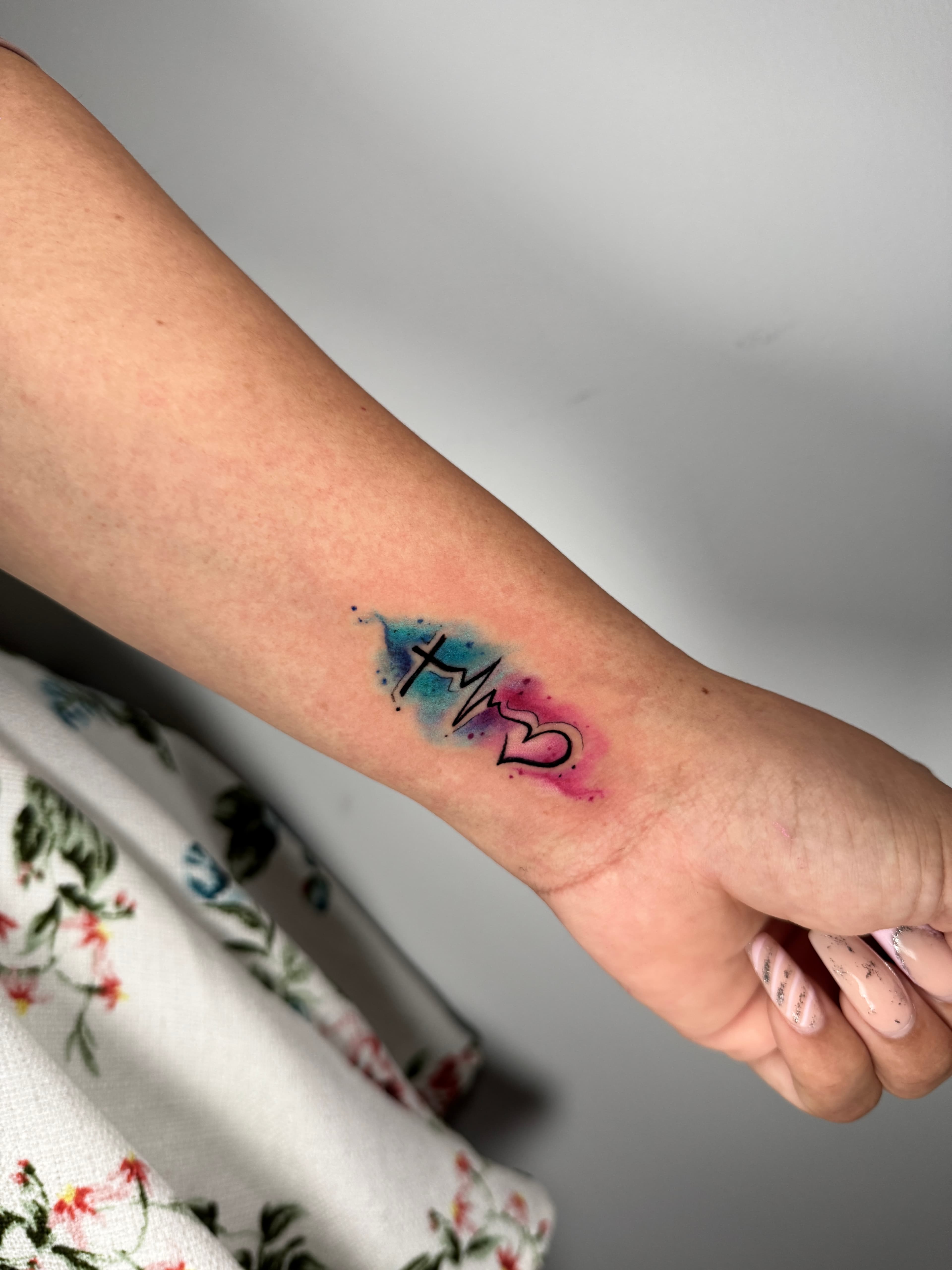 Watercolor inner wrist tattoo