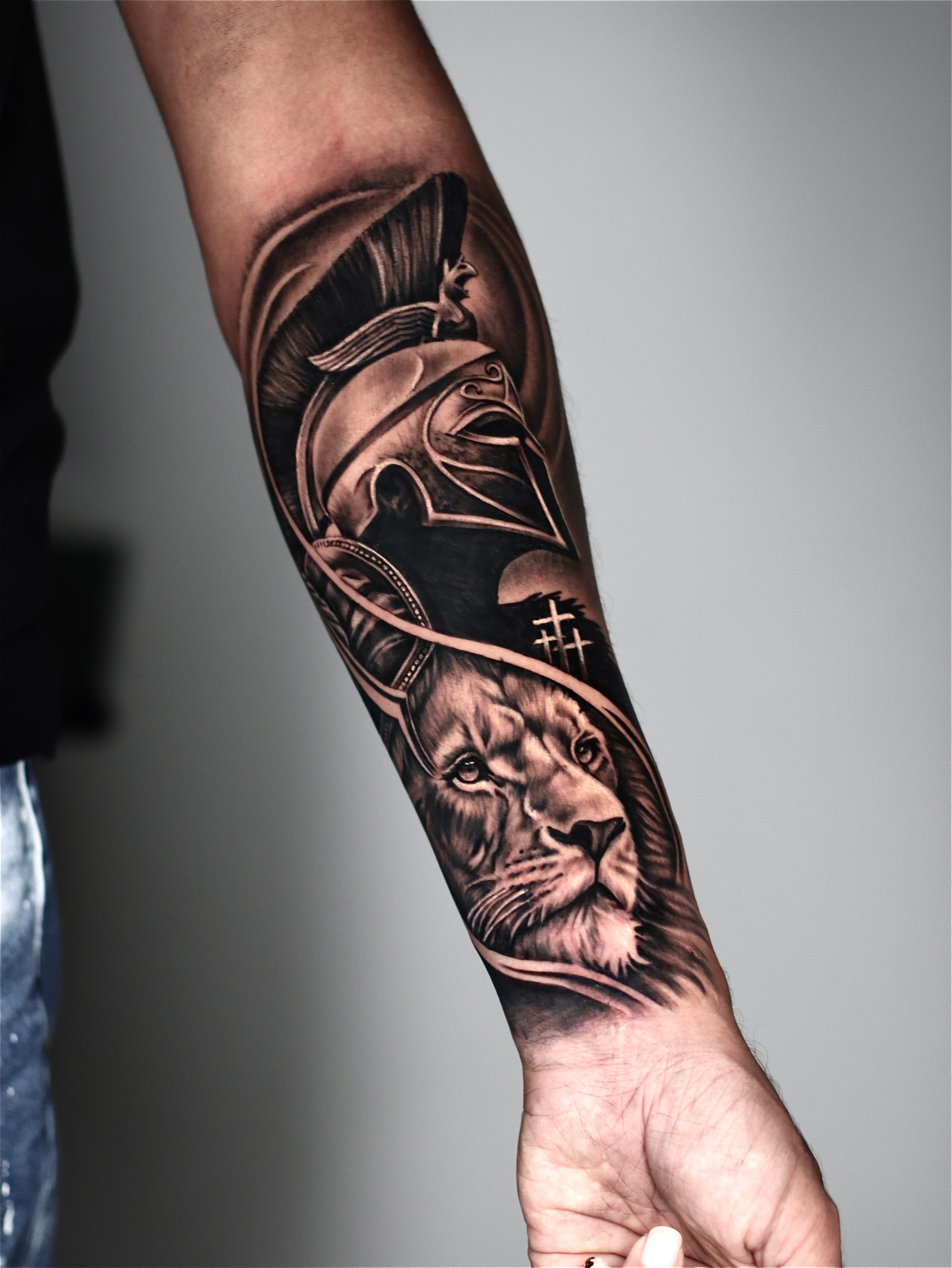 Spartan helmet and lion tattoo
