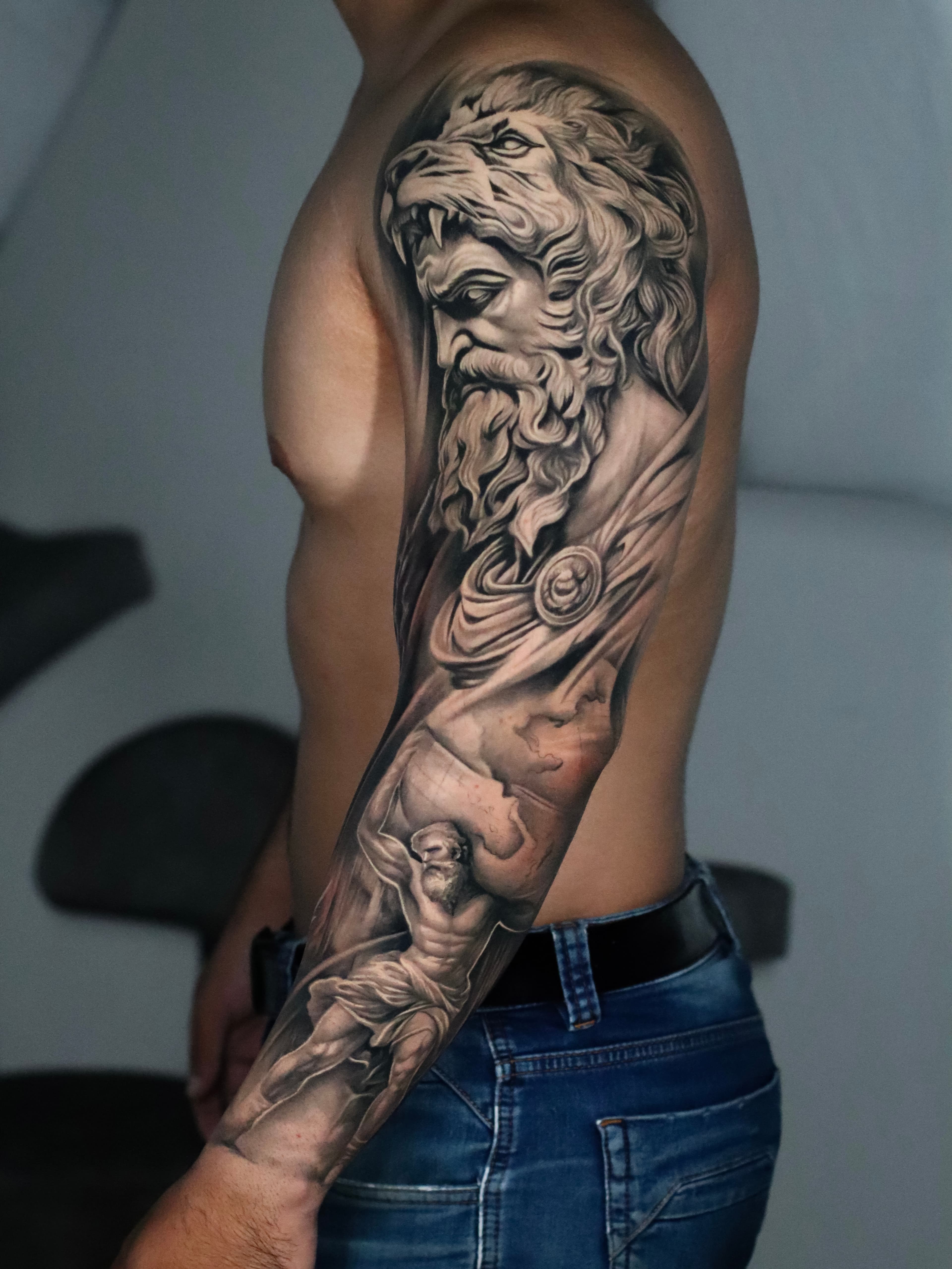 Realistic tattoo on male arm