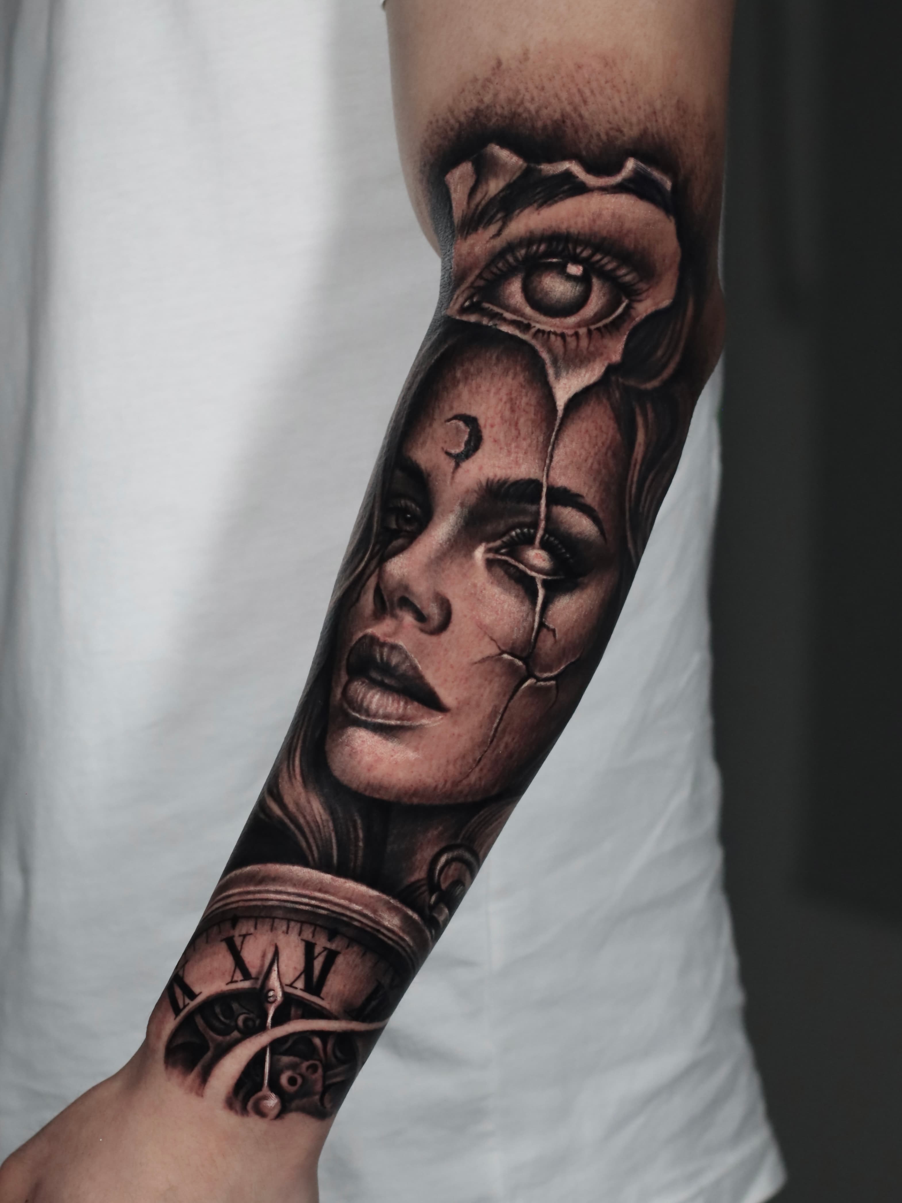 Surreal tattoo on man's arm