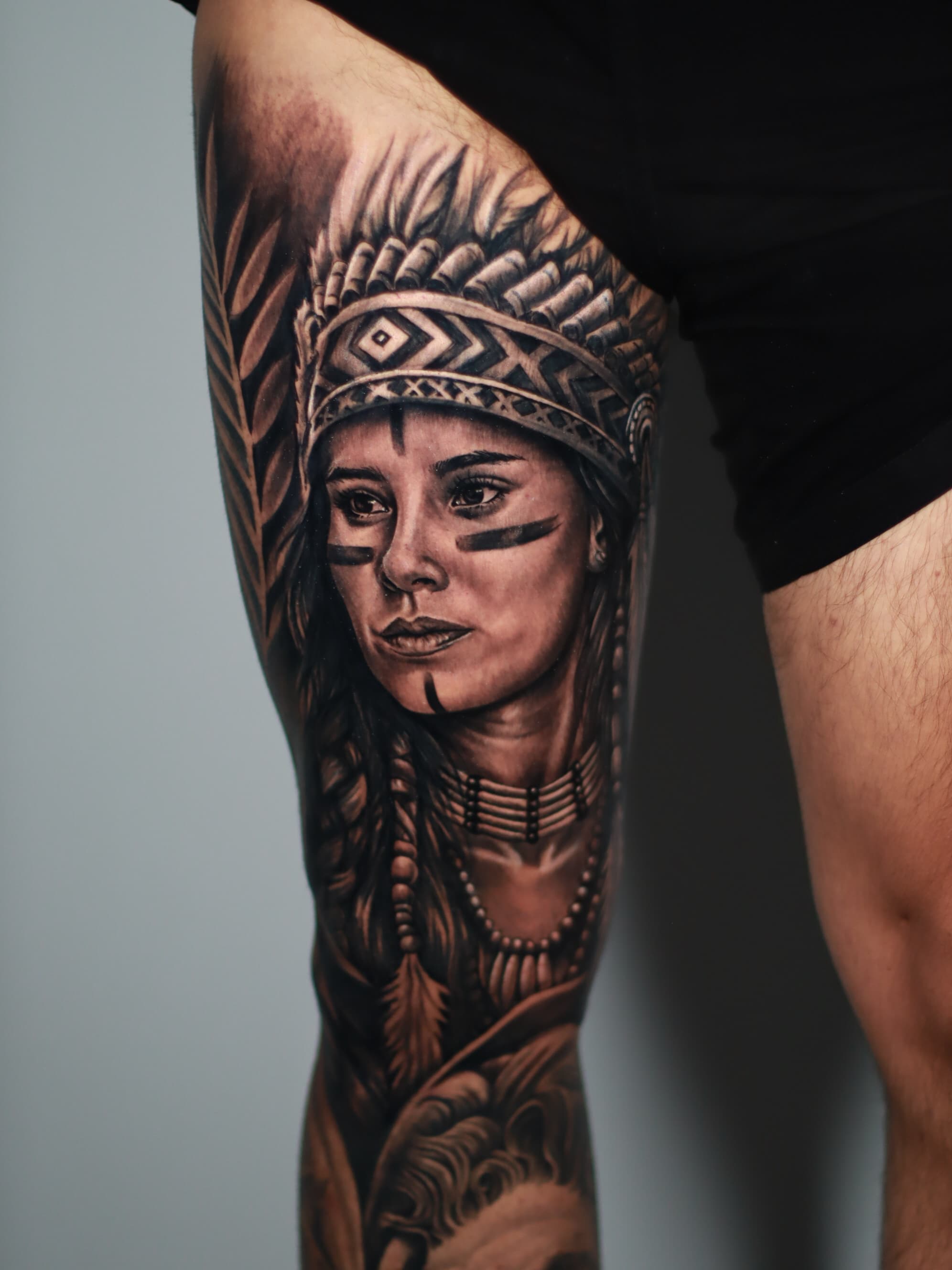 Native American woman leg sleeve black grey tattoo