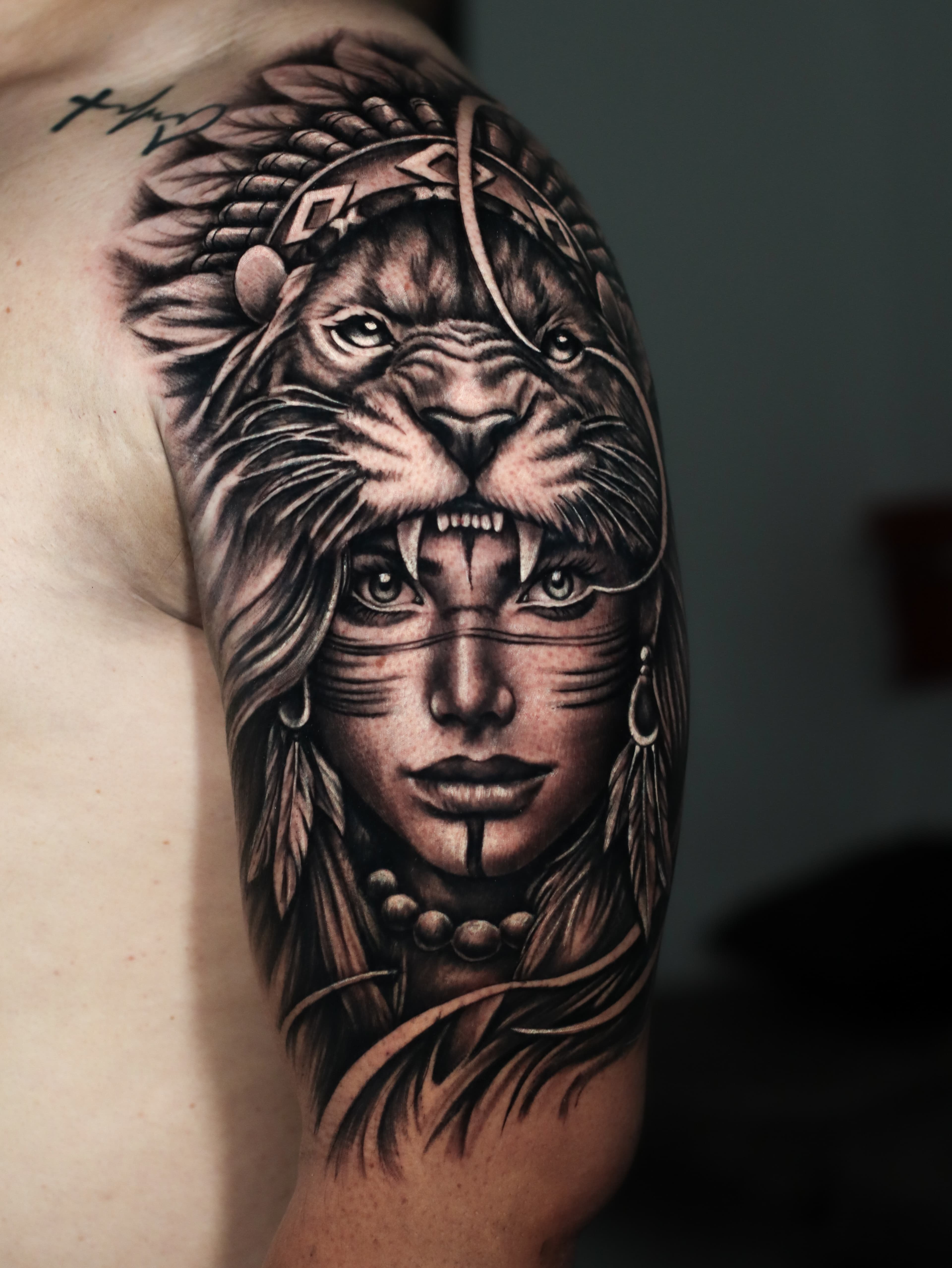 Warrior woman black grey shoulder portrait tattoo