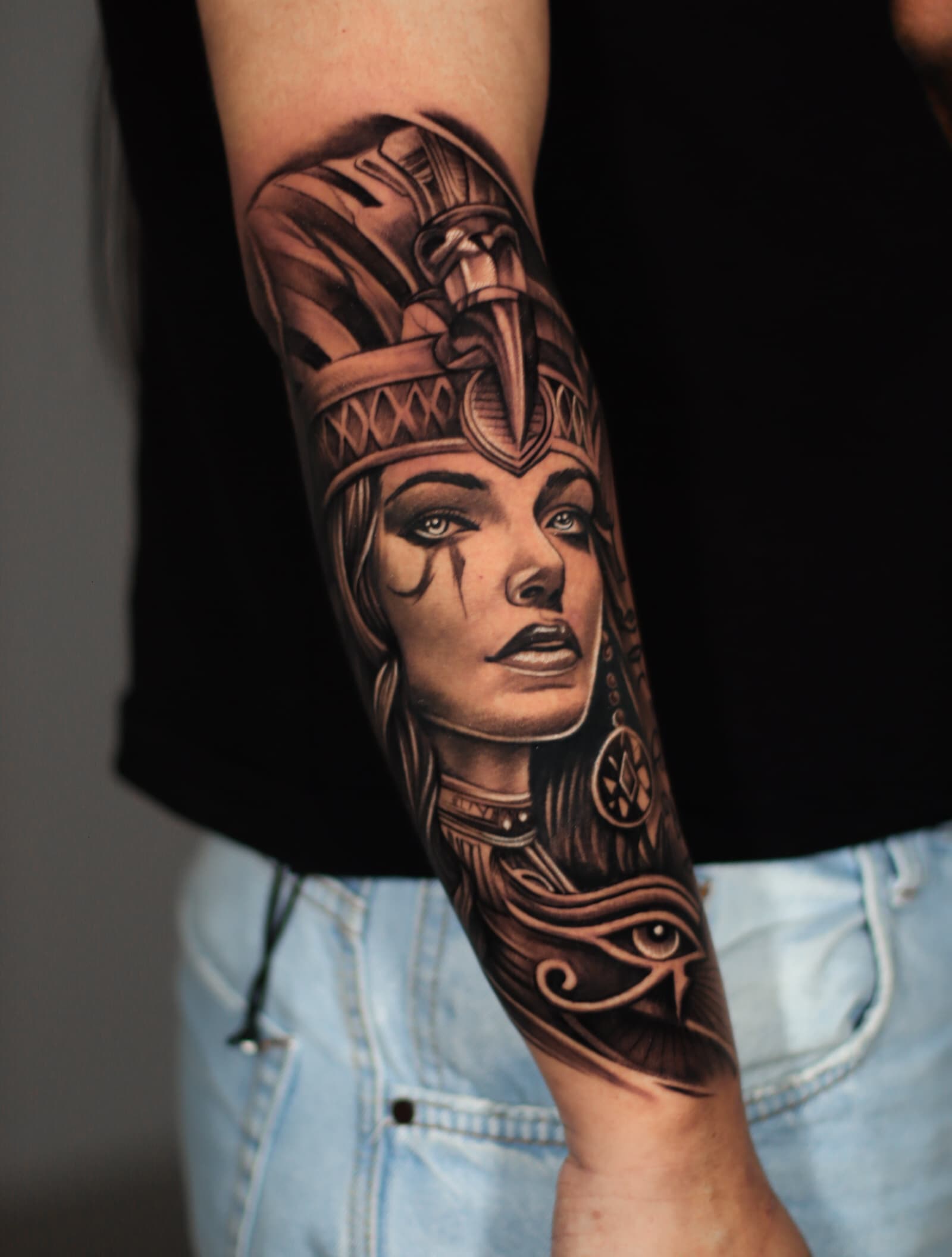 Egyptian goddess forearm black grey portrait tattoo
