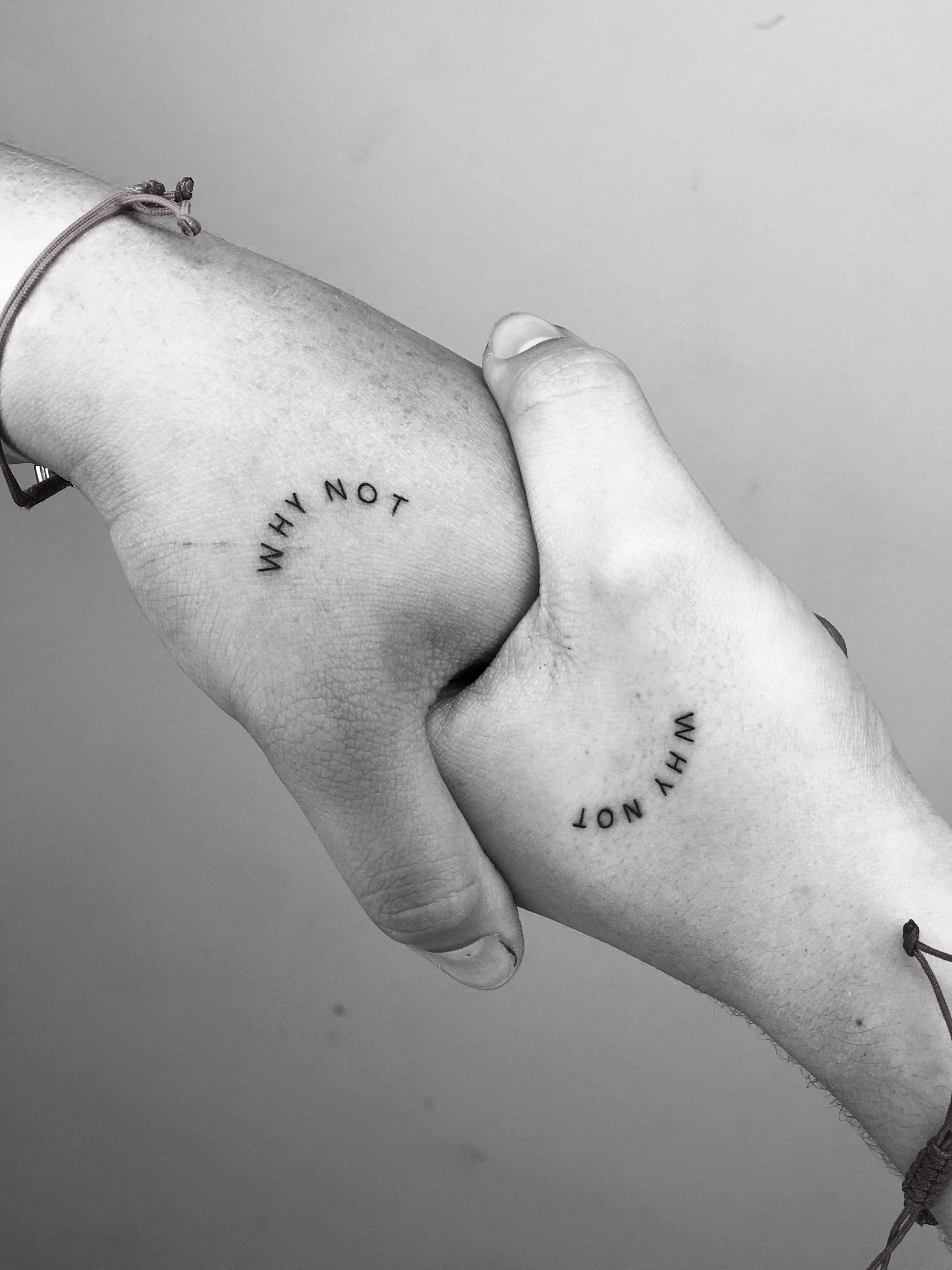 Matching hand tattoos