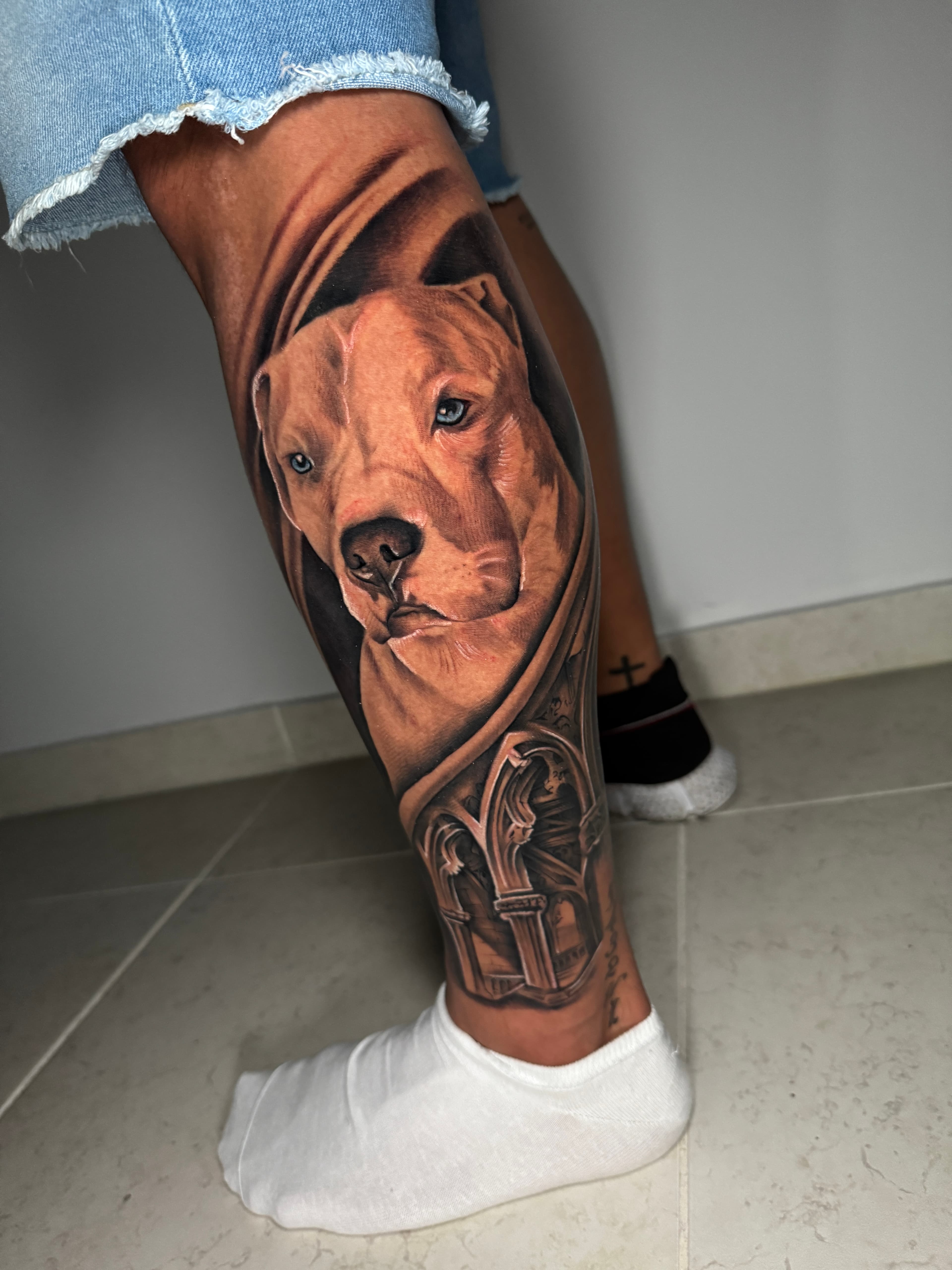 Dog portrait leg tattoo