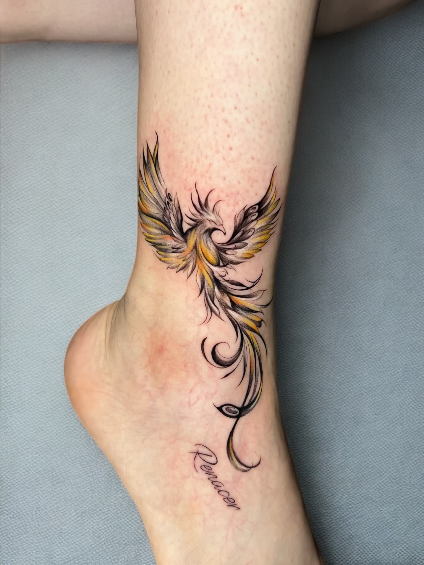 Ankle phoenix tattoo